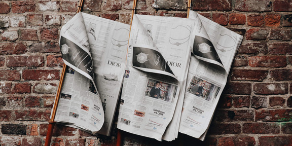 Newspapers on wall