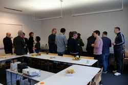 Departmental Research Day 2024_Communicative break The photo shows several participants of the Departmental Research Day continuing their discussions over drinks and snacks during the break.